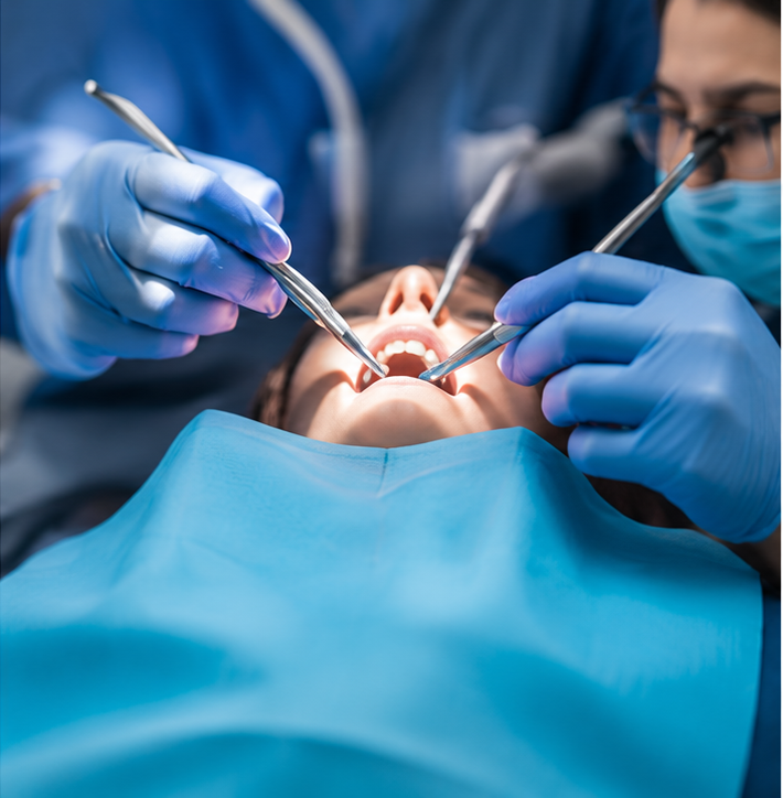 Close-up of a dental procedure performed by trainee dentists